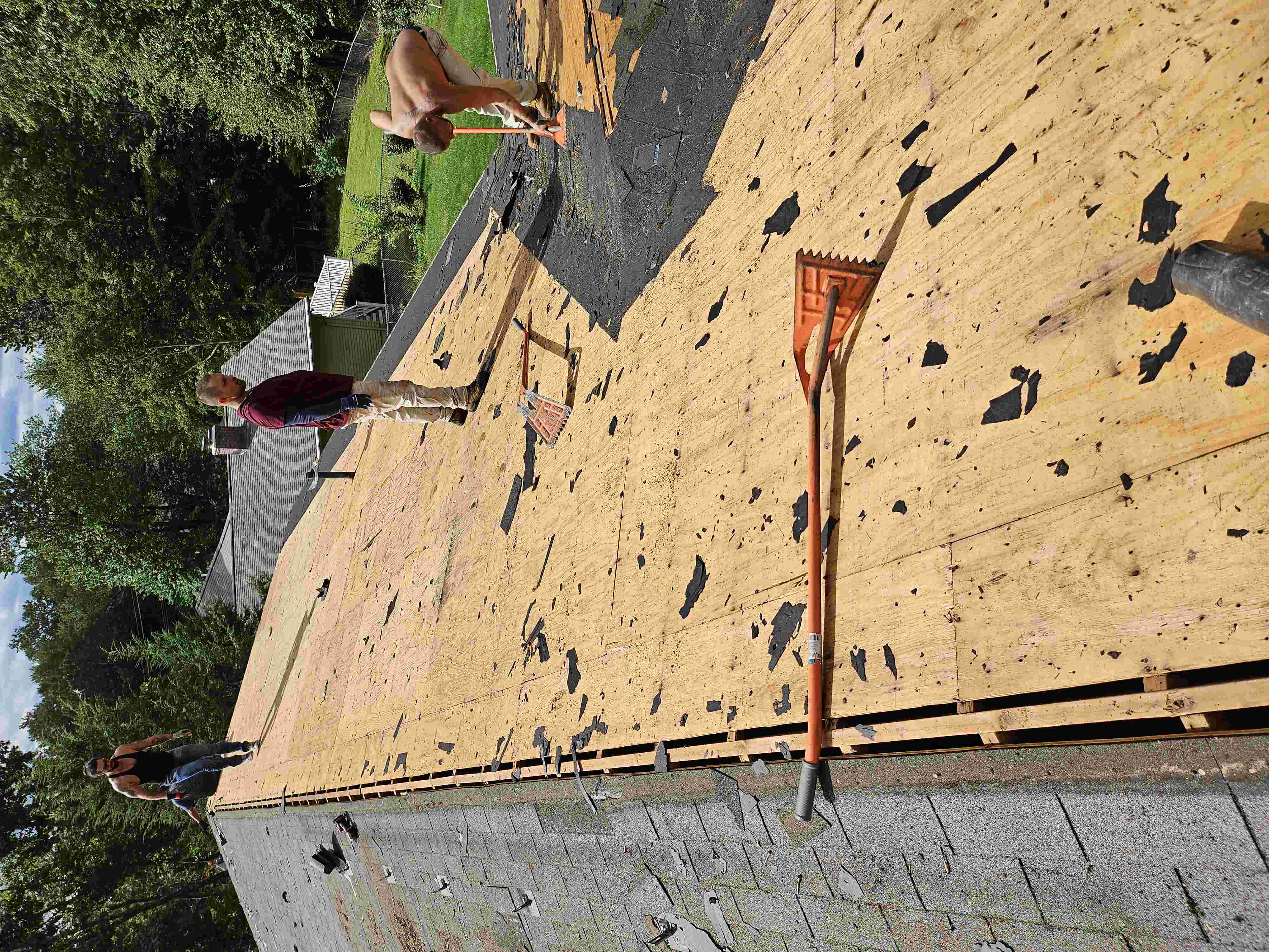 workers ripping roof