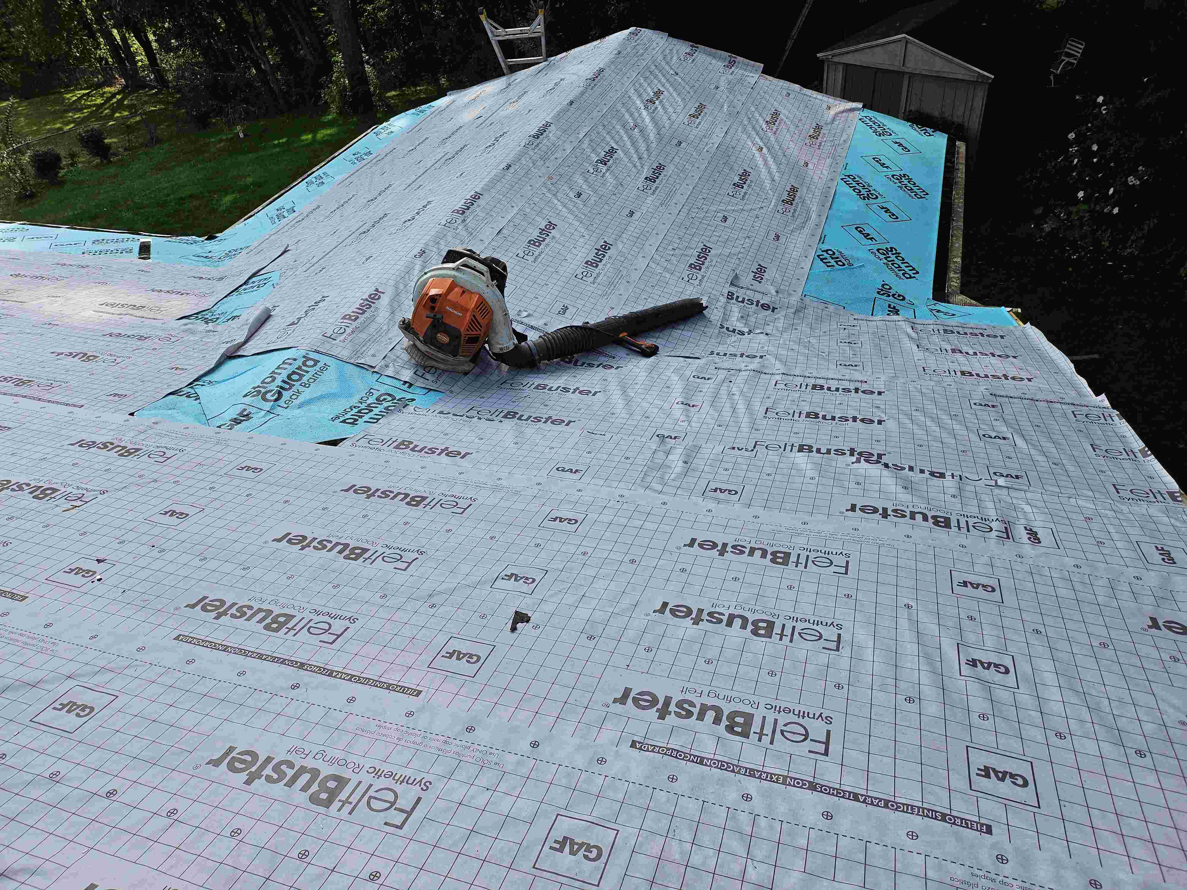 workers ripping roof