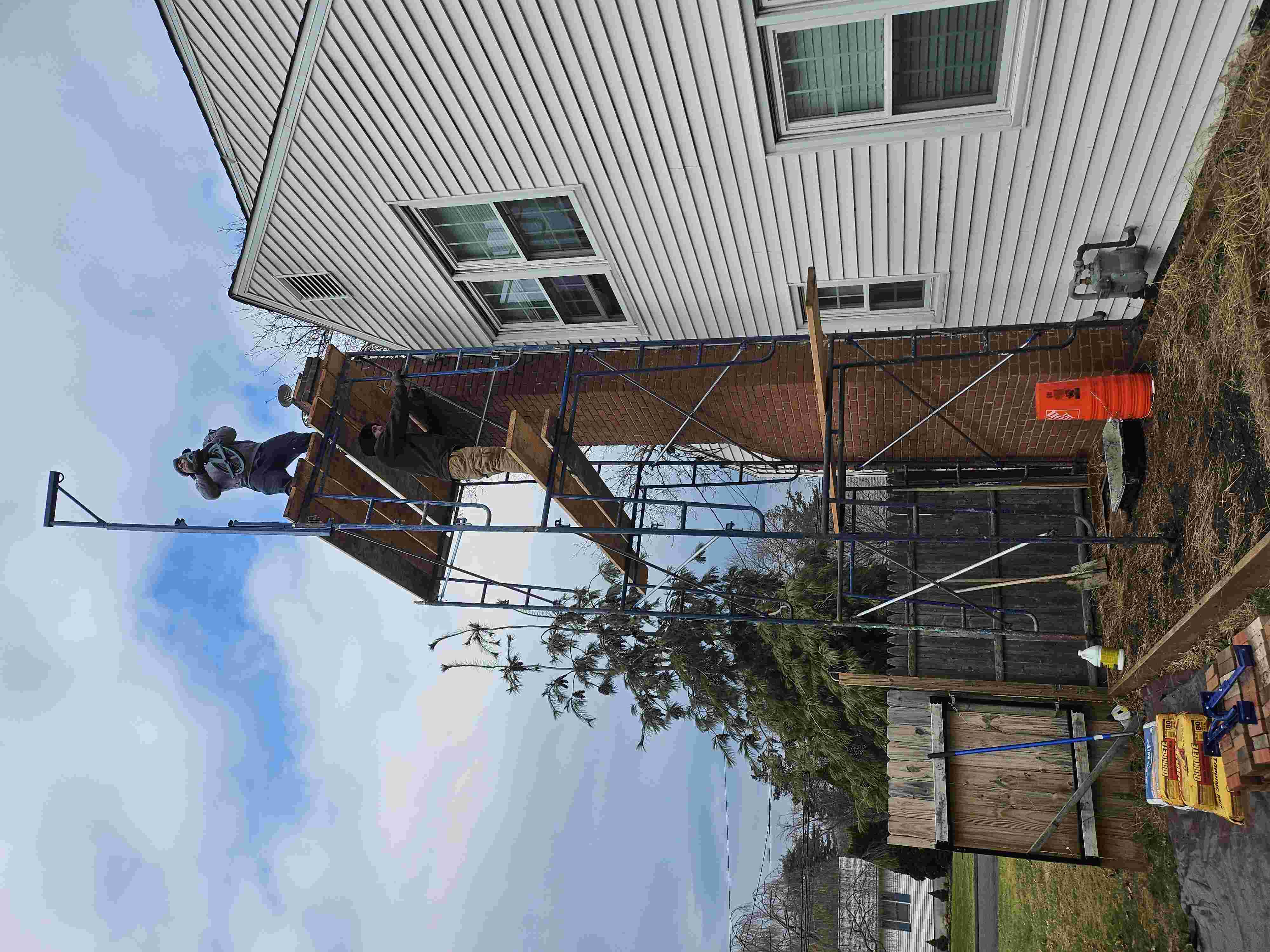 workers ripping roof