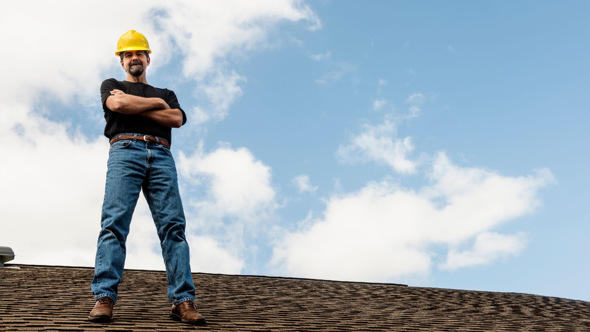 man standing on roof