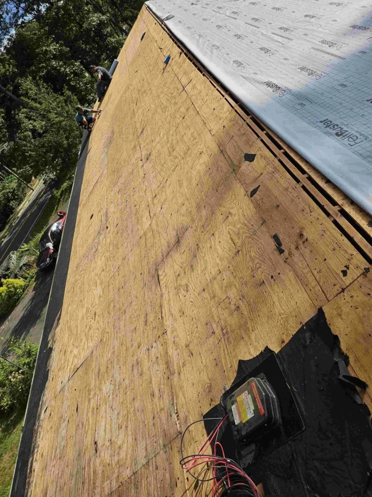workers ripping roof