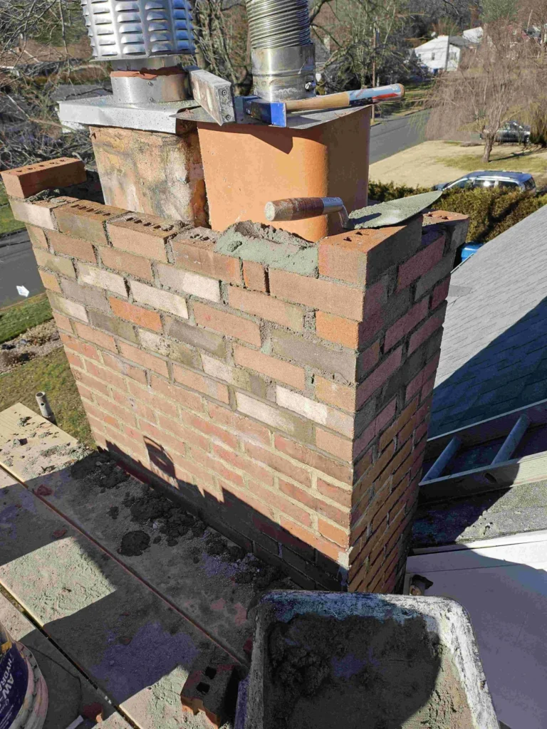 workers ripping roof