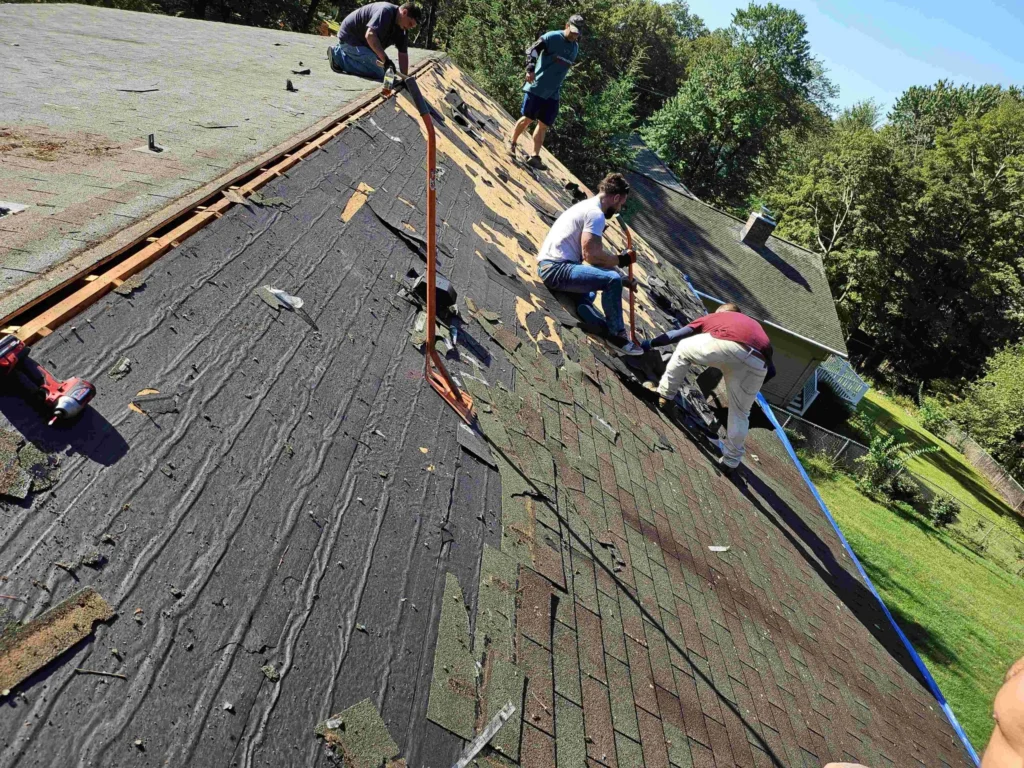 roofing crew working on a residential roof near West Hartford CT