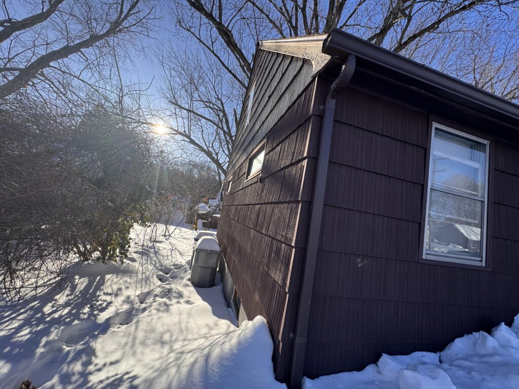 Before: weathered gable trim and original shingle siding, Bristol CT