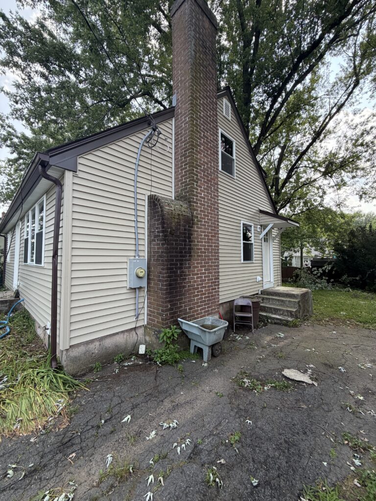 After: new siding around brick chimney, Bristol CT